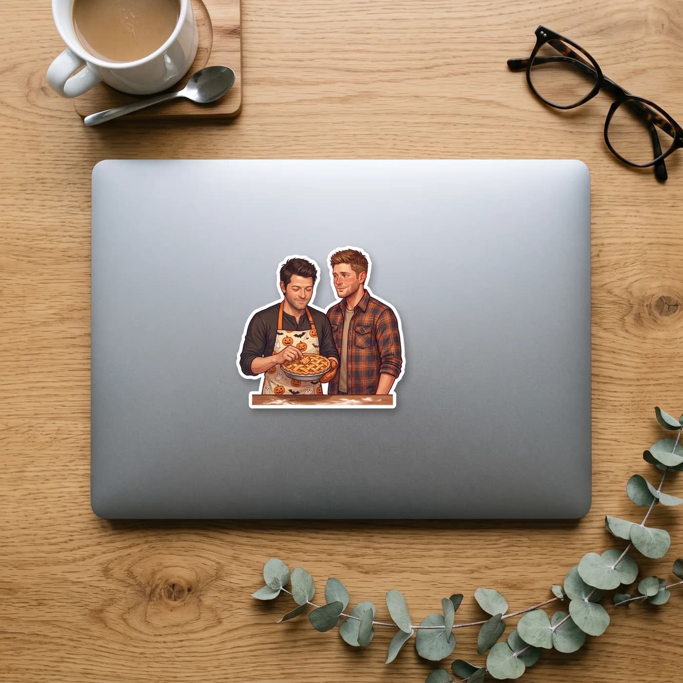 Wearing a festive apron, Cas focuses intently on baking a fresh, warm pie just for a very eager Dean., view 2