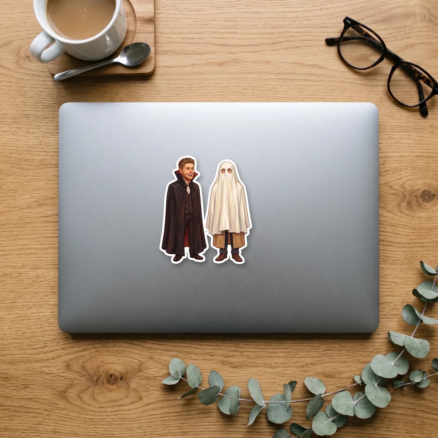 Dean dresses as a classic vampire while Castiel goes the simple route as a spooky white sheet ghost., view 2