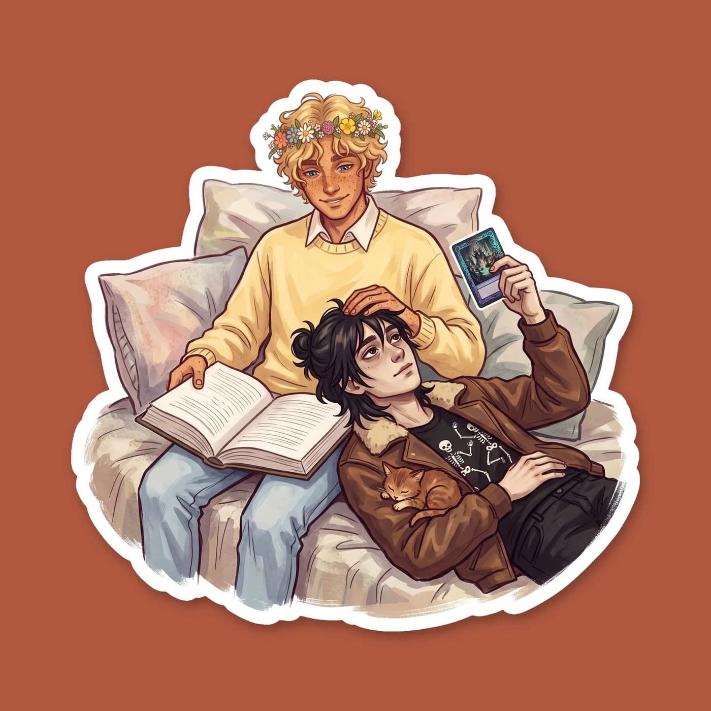 Tangled in blankets, Will reads aloud from a thick medical textbook while Nico rests his head on Will's chest. Mythomagic cards are scattered across the mattress around them as they wind down for the , view 2